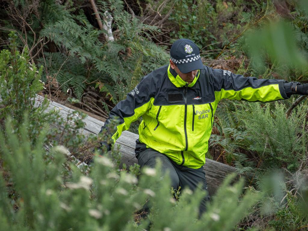 Search and rescue crews comb through dense bushland in Mount Hotham. Picture: Jason Edwards