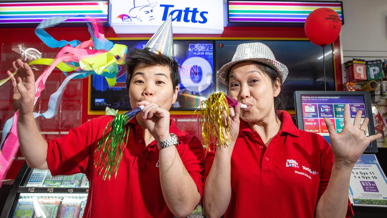 Winning Lotteries St Albans staff Seang Tay and Cindy May celebrate the win. Picture: Sarah Matray