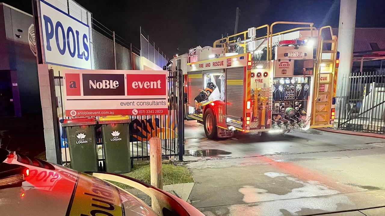 Two firefighters have been injured at a factory fire in Slacks Creek. Picture: QAS