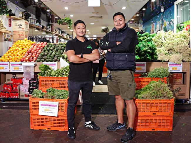 Asian veggies and cauliflower were the cheapest option at Strathfield Veggie Shed while fruit was out of the budget for many. Picture: Adam Yip