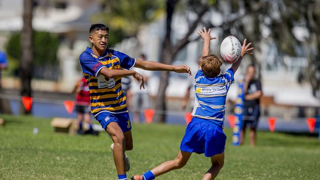 Day One of King of the Country rugby tournament at James Overell Park, Southport. possible. Sunshine Coast Invitational Barbarians U13s (Blue/yellow passing ball) v USQ Saints U13s. Picture: Jerad Williams