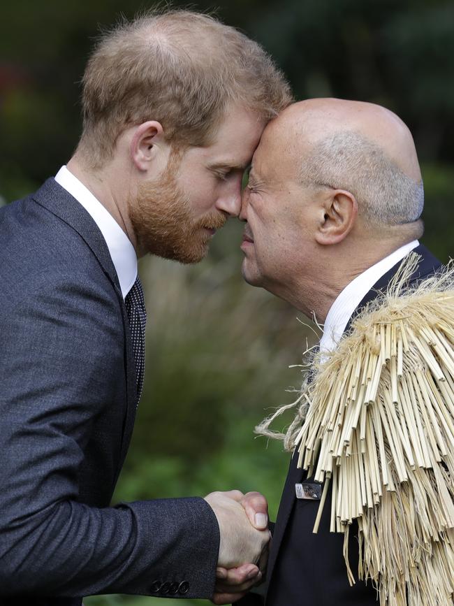 Britain's Prince Harry received a hongi, a traditional Maori welcome, on the lawns of Government House in Wellington... Picture: AP/Kirsty Wigglesworth)