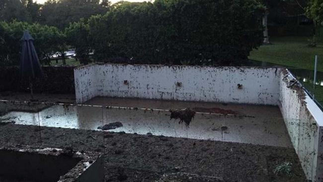 Cameron Russell’s ruined back yard and pool area after his house was flooded.