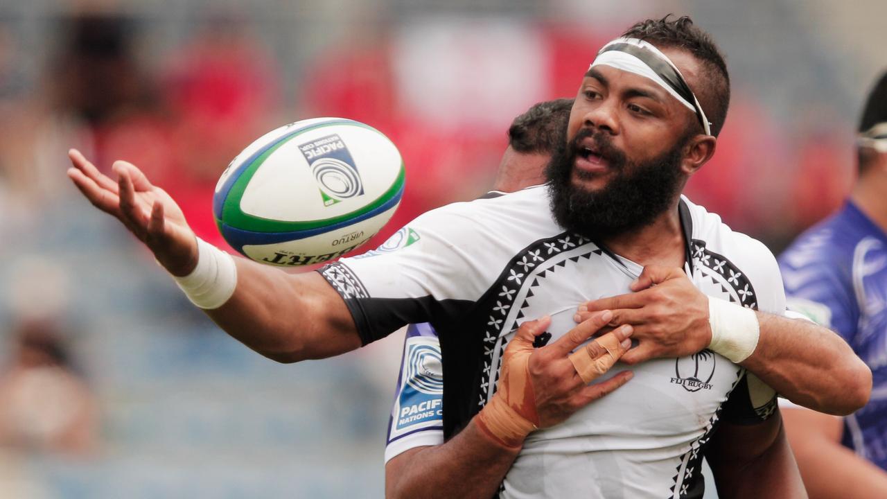 Api Naikatini of Fiji is tackled during a Pacific Nations Cup match against Samoa.