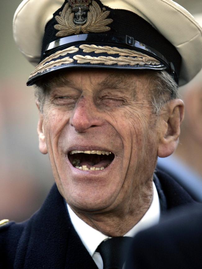 Britain's Prince Philip shares a joke with a war veteran in 2006. Picture: AP