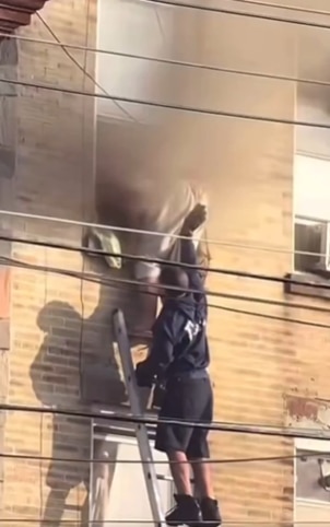 The man was climbing out of a third-story window. Picture: X@dom_lucre