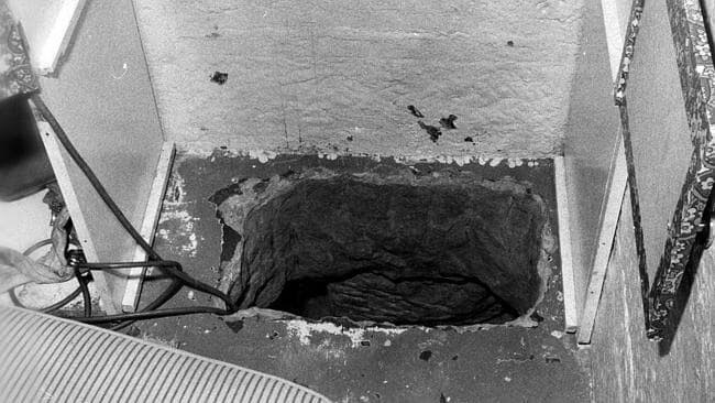 View of escape hole leading to a tunnel, cut through solid sandstone.