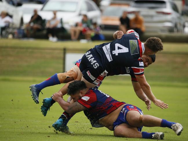 Camden’s Hugh Prebble crashes to the turf.