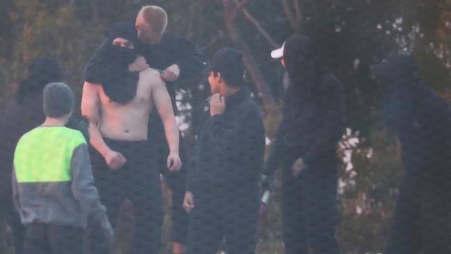 Inmates are removed from the roof of a Central Coast detention centre. Picture: John Grainger