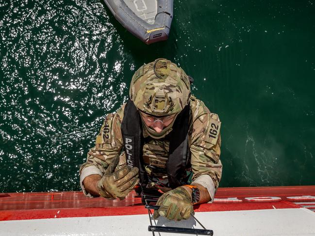 EMBARGOED 27TH OCTOBER WARNING WARNING FOR SUNDAY HERALD SUN ONLY - ONE TIME USE ONLY CANNOT BE USED FOR ANY OTHER PURPOSE DO NOT USE,  The Special Operations Group (SOG) conducts a high-level training exercise on the Spirit of Tasmania. SOG personnel scale a ladder before entering the ship. Picture: Jake Nowakowski