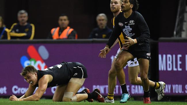 A dazzed Patrick Cripps after copping hit from Daniel Howe. Picture: AAP