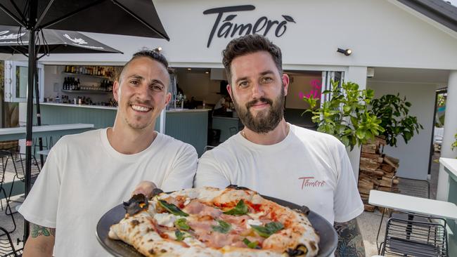 T’amerò owners Shayne Green and Marc Kinvig show off a freshly cooked wood-fired pizza ahead of the pizzeria’s opening on Saturday. Picture: Jerad Williams