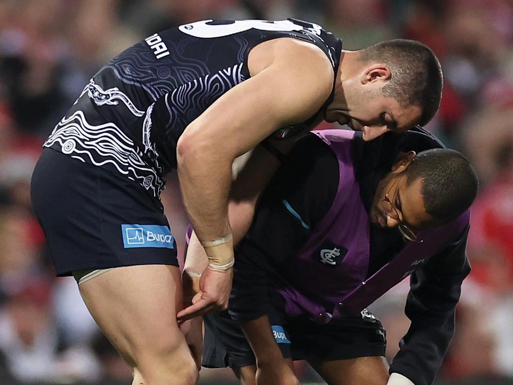 SYDNEY, AUSTRALIA - MAY 17: Jacob Weitering of the Blues receives medical attention during the round 10 AFL match between Sydney Swans and Carlton Blues at SCG, on May 17, 2024, in Sydney, Australia. (Photo by Cameron Spencer/Getty Images)