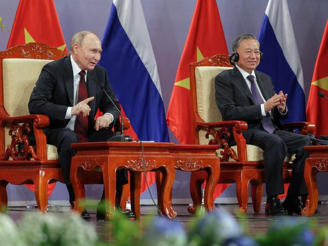 Russia's President Vladimir Putin (L) and Vietnam's President To Lam (R) take part in an event attended by the Vietnam Friendship Association in Hanoi. Picture: AFP