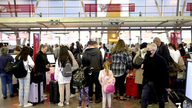 Sydney Airport was expecting 120,000 people throughout its three terminals on Friday but was confident of keeping queuing times to an average of 30 minutes. Picture: NCA/Damian Shaw