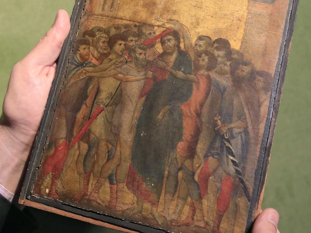 A masterpiece attributed to the 13th-century Italian painter Cimabue was discovered in an elderly French woman's kitchen, above her cooking hotplate. Picture: AP Photo/Michel Euler,