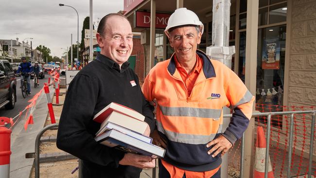 Bookseller Andrew Chugg with BMD supervisor Andy Lomas outside Dymocks, where trade has picked up during roadworks. Picture: Matt Loxton