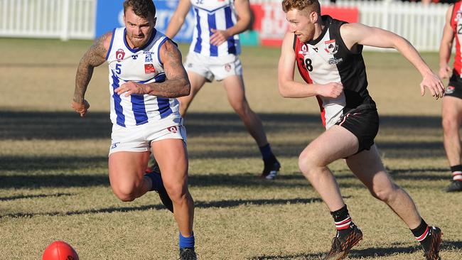 Mt Gravatt player Michael Doust and Morningside player Dylan Swann go for the ball in the QAFL game Mt Gravatt v Morningside. Saturday June 19, 2021. Picture, John Gass