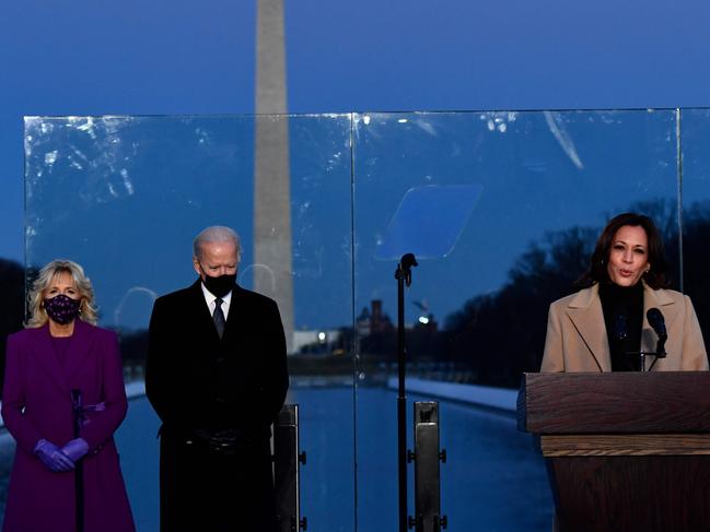 US Vice President-elect Kamala Harris speaks, flanked by US President-elect Joe Biden (2nd L) and wife Dr. Jill Biden, during a COVID-19 Memorial at the Lincoln Memorial in Washington. Picture: AFP.