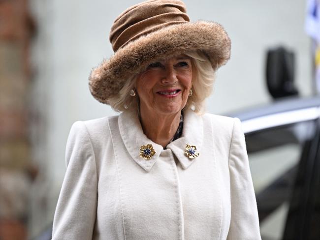 Queen Camilla smiles as she arrived for the Royal Maudy Service where she distributes the Maundy money to 75 men and 75 women. Picture: AFP