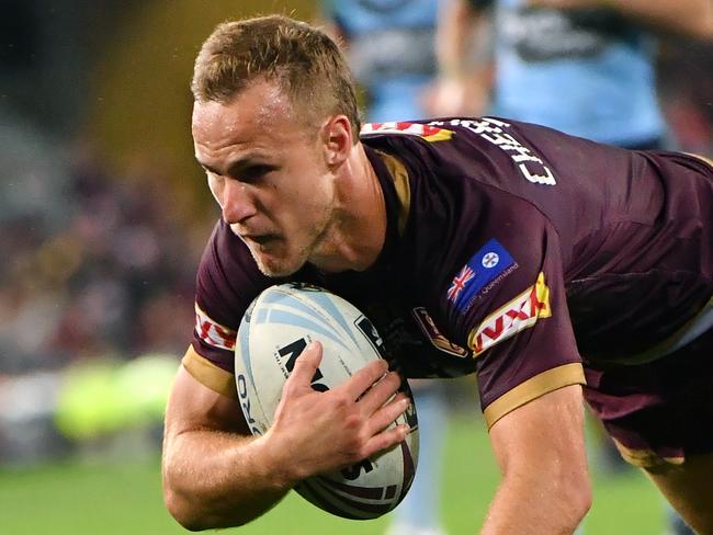 Daly Cherry-Evans of the Maroons dives over to score a try during Game 3 of the 2018 State of Origin series between the NSW Blues and the Queensland Maroons at Suncorp Stadium in Brisbane, Wednesday, July 11, 2018. (AAP Image/Darren England) NO ARCHIVING, EDITORIAL USE ONLY