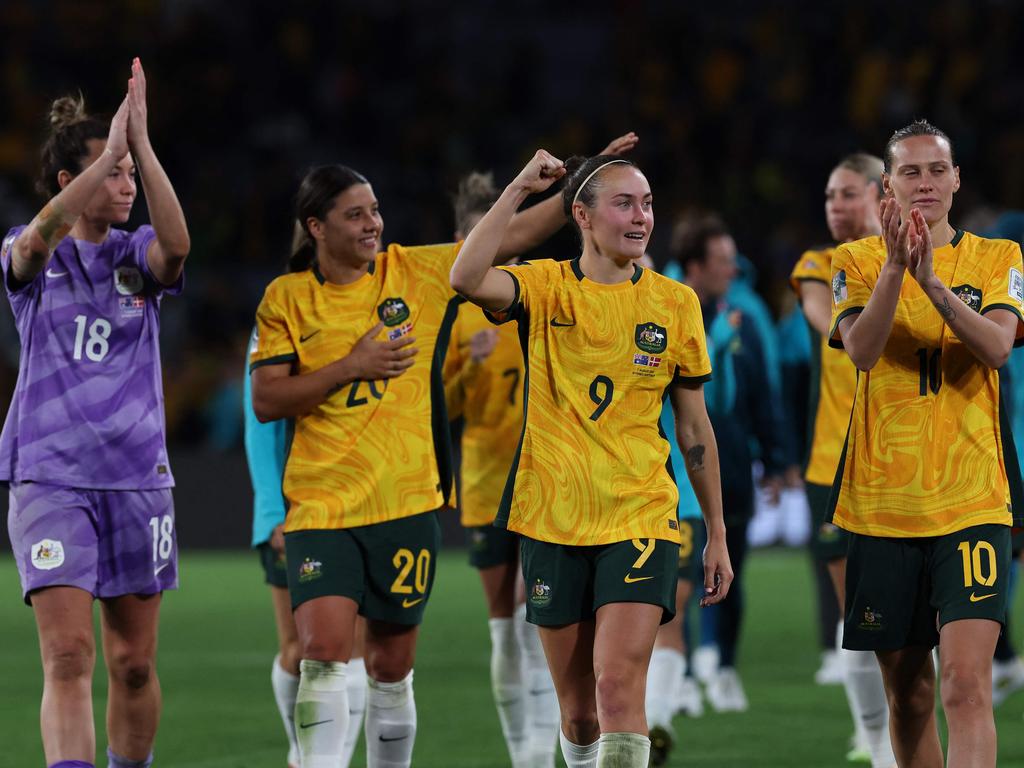 Caitlin Foord (C) celebrates with teammates after advancing to the quarter-finals. Picture: AFP