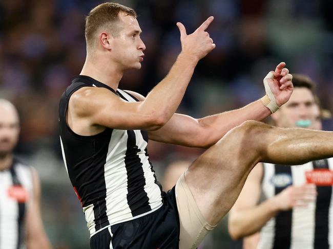 MELBOURNE, AUSTRALIA - JUNE 10: Nathan Kreuger of the Magpies kicks a goal during the 2024 AFL Round 13 match between the Collingwood Magpies and the Melbourne Demons at The Melbourne Cricket Ground on June 10, 2024 in Melbourne, Australia. (Photo by Michael Willson/AFL Photos via Getty Images)