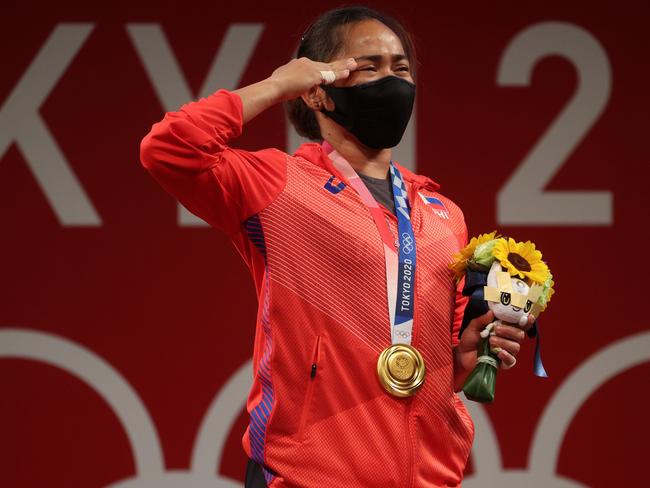 Visibly emotional, Hidilyn Diaz of Team Philippines poses with the gold medal during the medal ceremony for weightlifting. Picture: Chris Graythen/Getty Images)