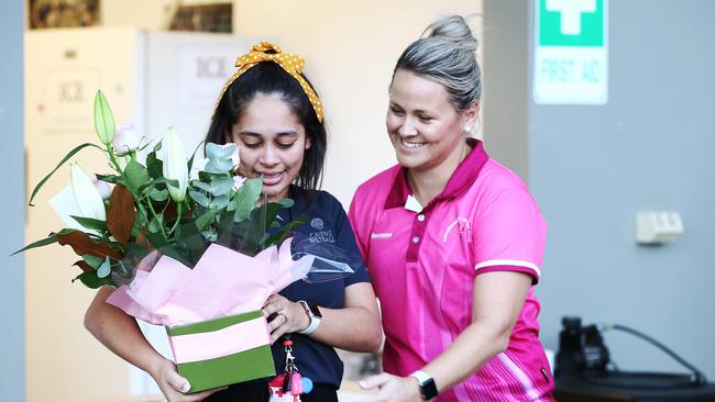 Cairns Netball Association competitions manager Darrien Patten is moving to Western Australia, finishing an eight-year stint with the association as a player, umpire and administrator. Patten is given flowers by former Cairns Netball Association operations manager and Leprechauns coach Kym McPhee-Smith. PICTURE: BRENDAN RADKE