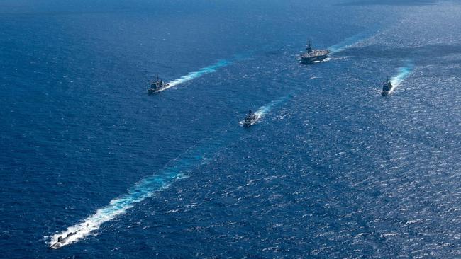 The US Navy’s only forward-deployed aircraft carrier, USS Ronald Reagan (CVN 76), steams in formation with the Royal Australian Navy ship HMAS Perth (FFH 157), as well as the Virginia-class fast-attack submarine USS North Carolina (SSN 777) and Ticonderoga-class guided-missile cruisers USS Robert Smalls (CG 62) and USS Antietam (CG 54), during Exercise Talisman Sabre 2023 in the Indian Ocean. Picture: Mass Communication Specialist 3rd Class Jordan Brown/US Navy