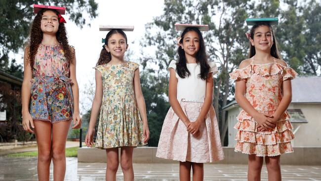 Scarlet Saad, Charlize Saad, Zara Ly and Charlotte Saab hone their etiquette skills at Old Government House in Parramatta Park. Picture: Jonathan Ng