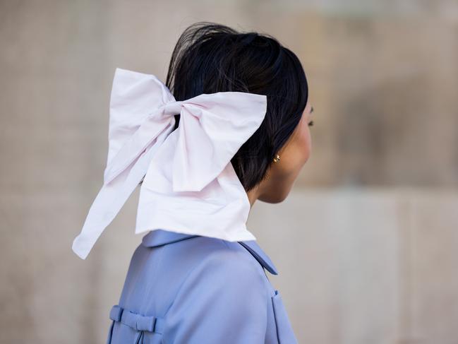 A guest wears bow tie in hair outside the Sandy Liang show during New York Fashion Week. Pic: Getty Images