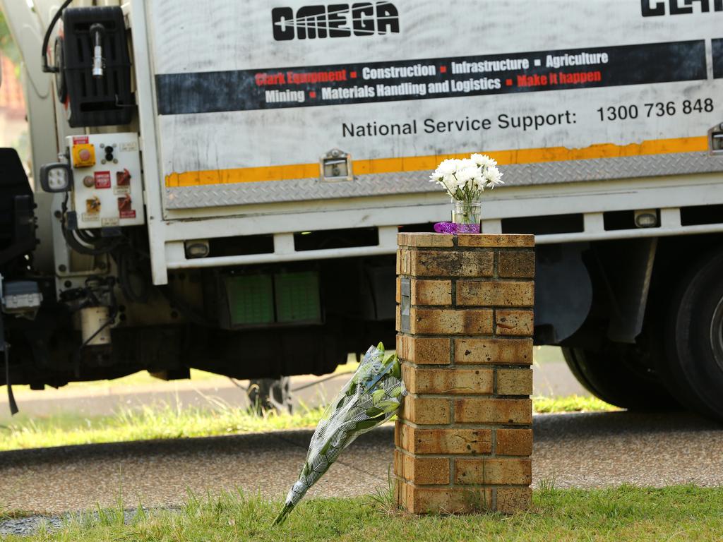 Pictures of flowers and other gifts left at the home of the Lovell family. Picture: David Clark