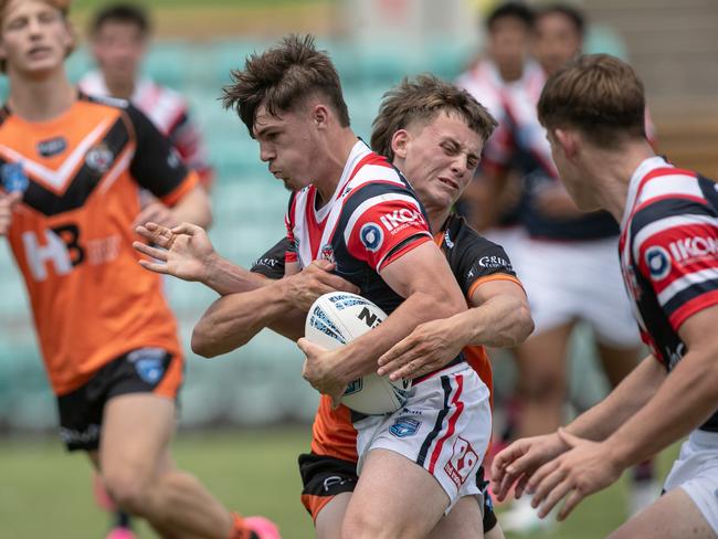 Lachlan Metcalfe is caught by the defence. Picture: Julian Andrews