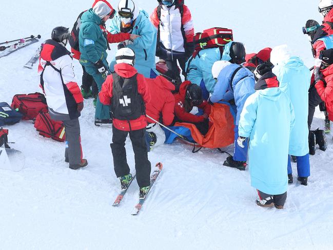 ZHANGJIAKOU, CHINA - FEBRUARY 03: Rina Yoshika of Team Japan  receives medical attention after crashing during the Snowboard Slopestyle Training session ahead of the Beijing 2022 Winter Olympic Games at the Genting Snow Park on February 03, 2022 in Zhangjiakou, China. (Photo by Clive Rose/Getty Images)