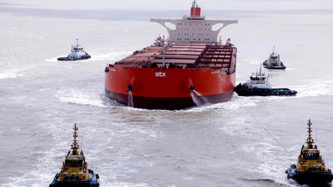 The ore carrier Vale Beijing is towed away from the Ponta da Madeira terminal, in Sao Luiz, northern Brazil.