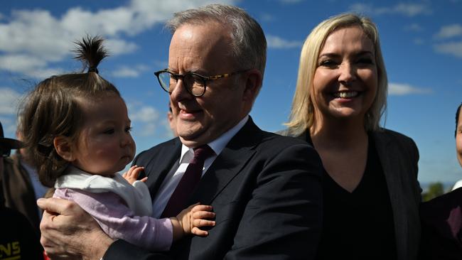 BRISBANE, AUSTRALIA - NewsWire Photos - JULY 11, 2024. The Prime Minister, Anthony Albanese, with the candidate for the seat of Ryan Rebecca Hack (centre) and a supporterâs toddler during a media op at Mount Coot-Tha lookout in Brisbane.Picture: Dan Peled / NewsWire