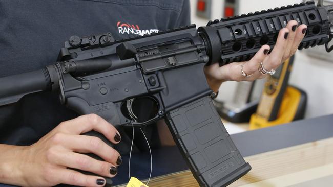 Courtney Manwaring holds an AR-15 semiautomatic gun at Action Target on June 17, 2016 in Springville, Utah. Picture: George Frey