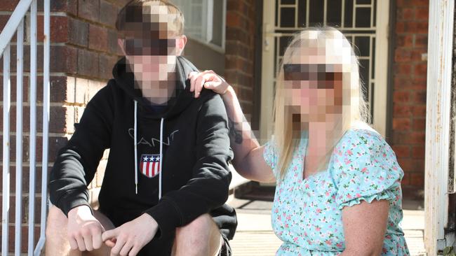 Cooper, 16, pictured with his mum, claims he was bullied by his work experience boss. Picture: Dean Martin