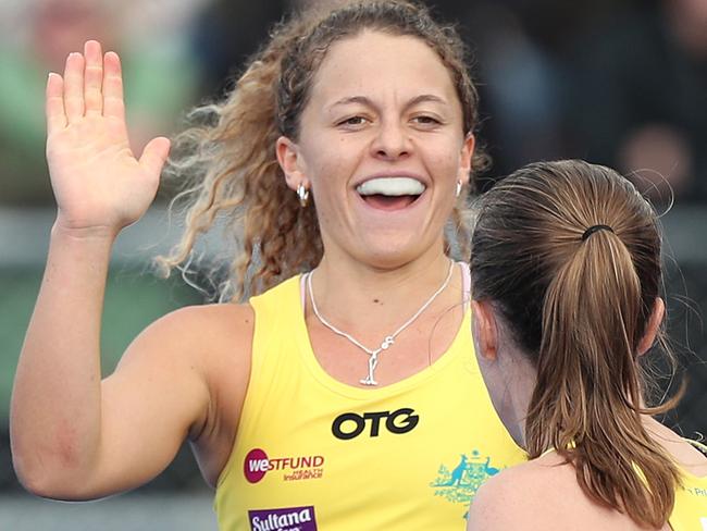 PALMERSTON NORTH, NEW ZEALAND - MAY 30: Rosie Malone (L) is congratulated on scoring a goal by Emily Chalker of Australia during the Trans-Tasman Series Hockey Match between New Zealand and Australia on May 30, 2021 in Palmerston North, New Zealand. (Photo by Dave Rowland/Getty Images)