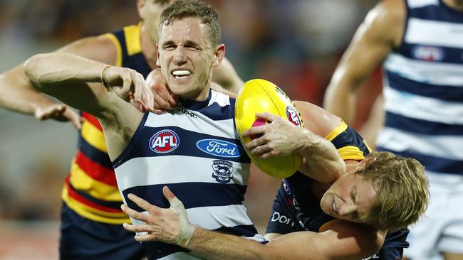 Joel Selwood cops a high tackle from Rory Sloane. Picture: Michael Klein