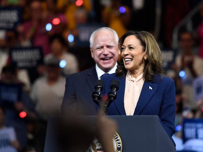 TOPSHOT - US Vice President and 2024 Democratic presidential candidate Kamala Harris and her running mate Minnesota Gorvernor Tim Walz speak at Temple University's Liacouras Center in Philadelphia, Pennsylvania, August 6, 2024, on the first day of their "Battleground State Tour".  (Photo by MATTHEW HATCHER / AFP)