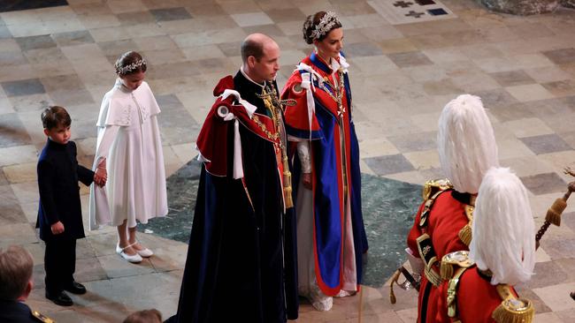 Princess Charlotte and Prince Louis stood behind their parents. Picture: Phil Noble / Pool / AFP