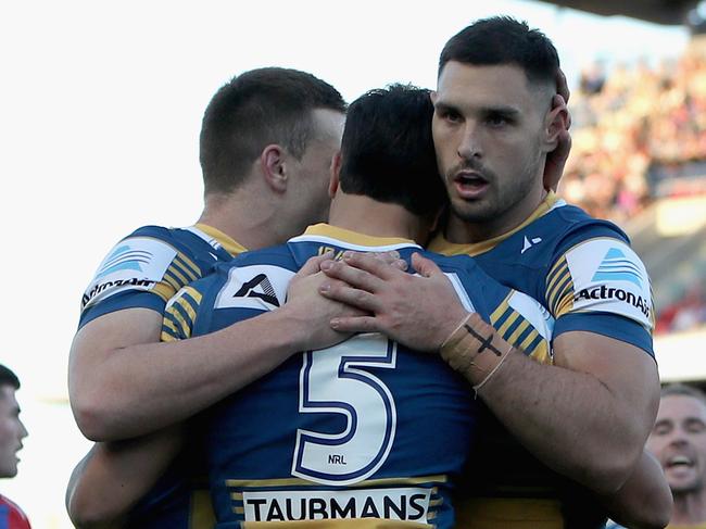 NEWCASTLE, AUSTRALIA - JUNE 06: Haze Dunster of the Eels celebrates his try with team mates during the round 13 NRL match between the Newcastle Knights and the Parramatta Eels at McDonald Jones Stadium, on June 06, 2021, in Newcastle, Australia. (Photo by Ashley Feder/Getty Images)