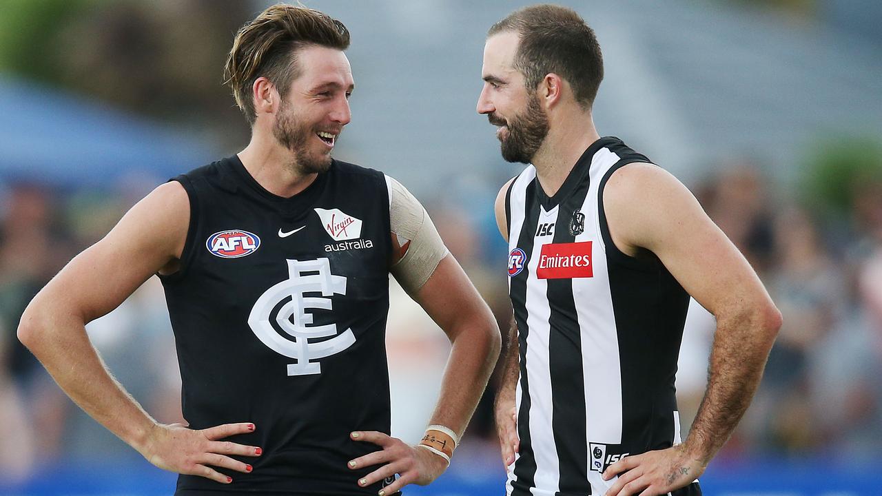 Dale Thomas of the Blues with Steele Sidebottom of the Magpies - old mates reunited in the country