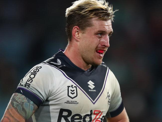 SYDNEY, AUSTRALIA - JULY 23: Cameron Munster of the Storm looks on during the round 19 NRL match between the South Sydney Rabbitohs and the Melbourne Storm at Stadium Australia on July 23, 2022 in Sydney, Australia. (Photo by Jason McCawley/Getty Images)