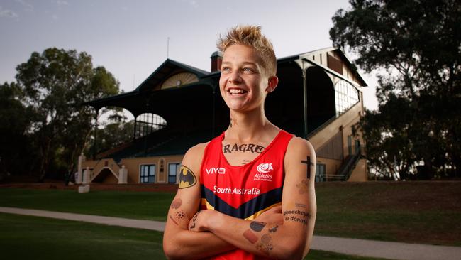 Adelaide runner Isaac Heyne, pictured in 2019, covered in temporary tattoos in honour of his mum who died of cancer. Picture Matt Turner