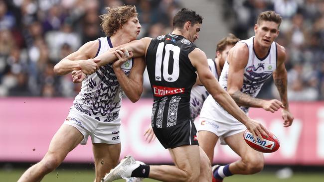 Scott Pendlebury and Nat Fyfe go head-to-head. Picture: AAP