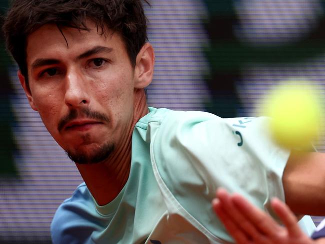 Australia's Alexei Popyrin eyes the ball as he plays against US Tommy Paul during their men's singles match on day 8 of the French Open tennis tournament on Court Suzanne-Lenglen at the Roland-Garros Complex in Paris on June 1, 2025. (Photo by Anne-Christine POUJOULAT / AFP)