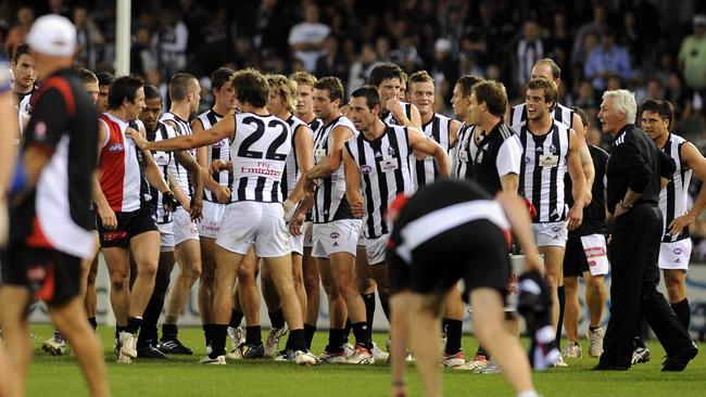 Mick Malthouse has a heated exchange with Stephen Milne.